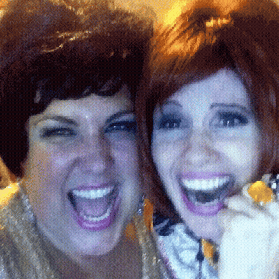 Two Women Are Posing For A Picture With Their Mouths Wide Open GIF