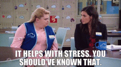 Two Women Are Sitting At A Table And One Of Them Is Saying `` It Helps With Stress . You Should Have Known That . '' GIF