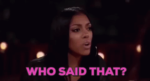 Two Women Are Sitting At A Table With Glasses Of Champagne And The Words `` Who Said That '' Above Them . GIF