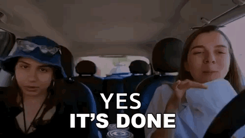Two Women Are Sitting In The Back Seat Of A Car And One Of Them Is Holding A Can Of Soda . GIF