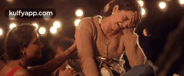 Two Women Are Sitting Next To Each Other And One Is Crying . GIF
