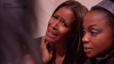 Two Women Are Sitting Next To Each Other And One Of Them Is Crying And The Words Real Housewives Are On The Bottom GIF