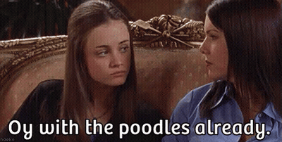 Two Women Are Sitting Next To Each Other On A Couch And One Of Them Is Talking To The Other . GIF