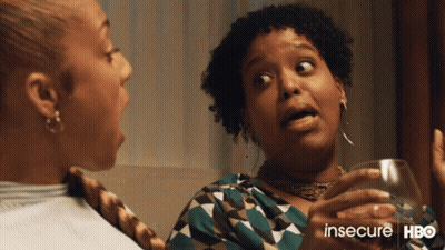 Two Women Are Sitting Next To Each Other With The Words Insecure Hbo On The Bottom Right GIF