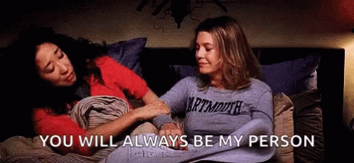 Two Women Are Sitting On A Bed Holding Hands And The Words `` You Will Always Be My Person '' Are Visible . GIF