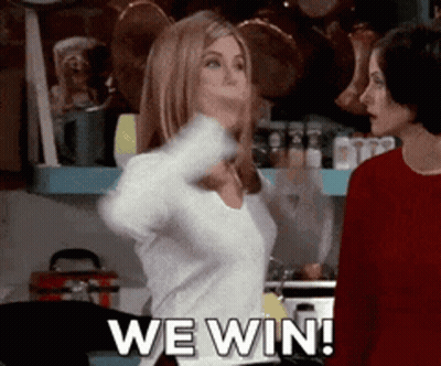 Two Women Are Standing In A Kitchen And One Of Them Is Saying We Win ! GIF