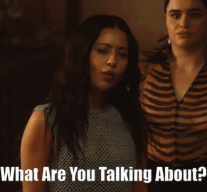 Two Women Are Standing Next To Each Other And One Of Them Is Asking The Other What Are You Talking About GIF