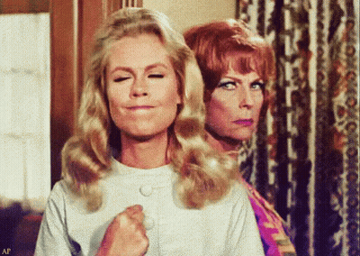 Two Women Are Standing Next To Each Other And One Of Them Is Making A Funny Face GIF
