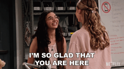 Two Women Are Standing Next To Each Other And One Of Them Is Saying I 'M So Glad That You Are Here GIF