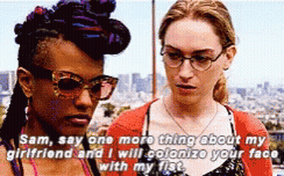 Two Women Are Standing Next To Each Other And One Of Them Is Saying " Sam Say One More Thing About My Girlfriend " GIF