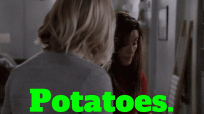 Two Women Are Standing Next To Each Other And The Word Potatoes Is On The Screen GIF