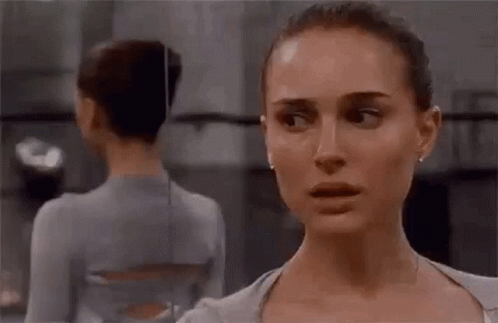 Two Women Are Standing Next To Each Other In A Dance Studio . GIF
