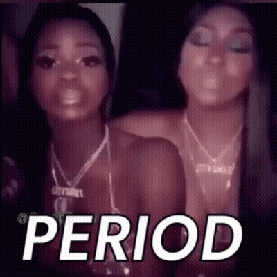 Two Women Are Standing Next To Each Other In A Dark Room And The Word Period Is On The Screen . GIF