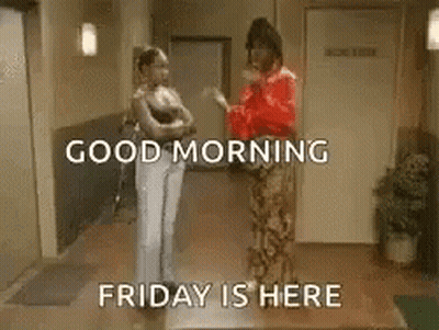 Two Women Are Standing Next To Each Other In A Hallway And Talking . GIF