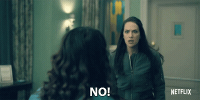 Two Women Are Standing Next To Each Other In A Room And One Is Saying No . GIF