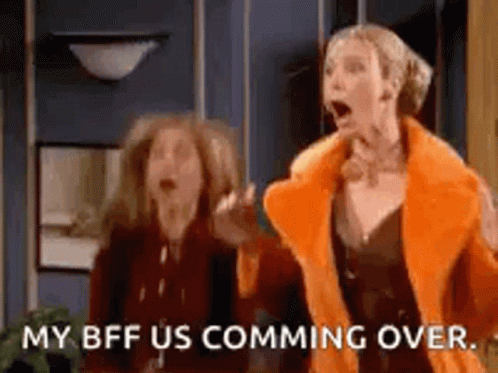 Two Women Are Standing Next To Each Other In A Room . GIF