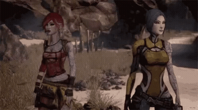 Two Women Are Standing Next To Each Other On A Beach . GIF