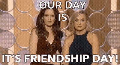 Two Women Are Standing Next To Each Other On A Stage With A Microphone . GIF
