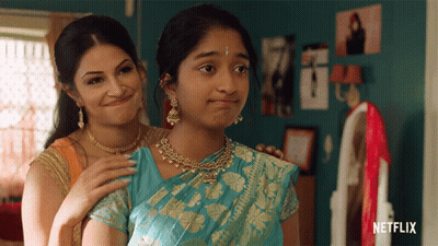 Two Women Are Standing Next To Each Other With Netflix Written On The Bottom Right GIF