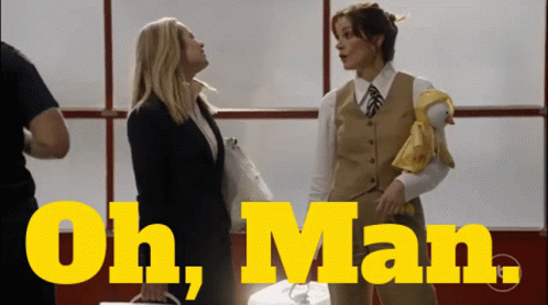 Two Women Standing With Oh Man Text GIF