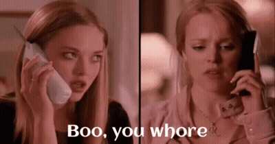 Two Women Are Talking On Cell Phones And One Of Them Says Boo You Whore . GIF