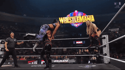 Two Women Are Wrestling In A Ring With A Sign That Says World Heavyweight Championship GIF