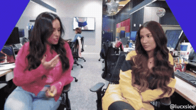 Two Women At Desk With Blue LuckSlee Border GIF