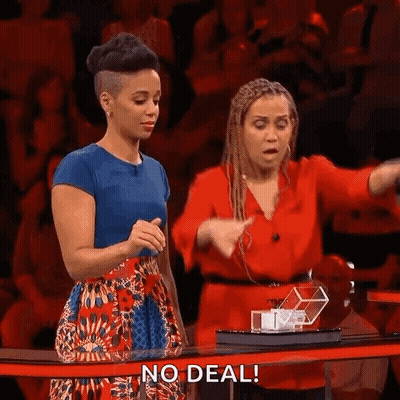 Two Women At Table With No Deal Sign GIF