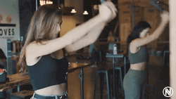 Two Women Axe Throwing GIF