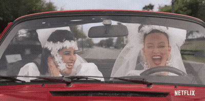 Two Women Bride And Groom Driving Red Car With Netflix GIF