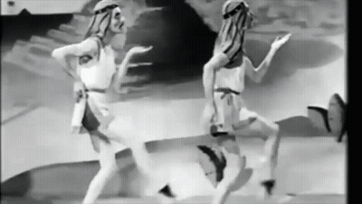 Two Women Dancing In Black And White Desert GIF