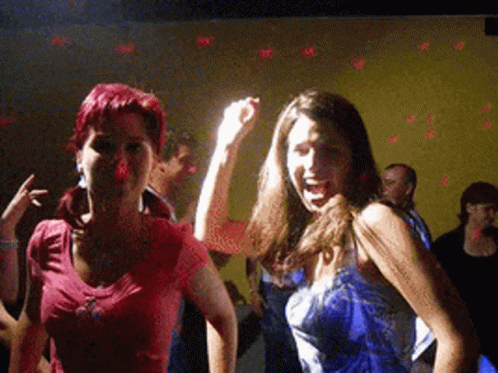 Two Women Dancing In Dark Room One In Blue Dress GIF