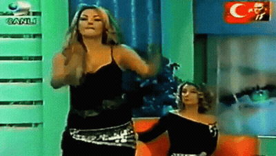 Two Women Dancing In Front Of Canli Logo GIF