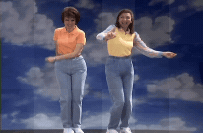 Two Women Dancing In Front Of Cloudy Sky GIF