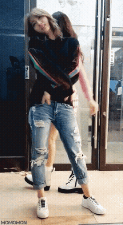 Two Women Dancing In Front Of Glass Door Momomon GIF