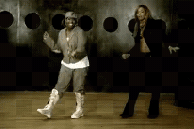 Two Women Dancing In Front Of Hole Wall GIF