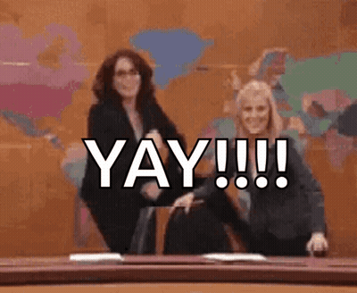 Two Women Dancing In Front Of Yay Wall GIF