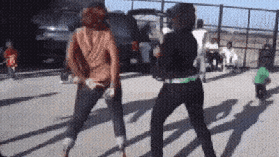 Two Women Dancing In Parking Lot GIF