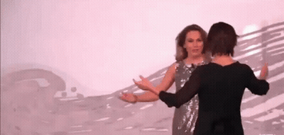 Two Women Dancing On Stage GIF