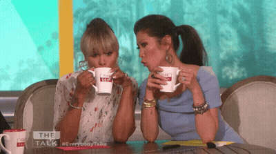 Two Women Drinking From The Talk Mugs GIF