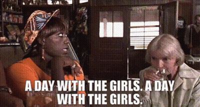 Two Women Drinking Wine At Table GIF