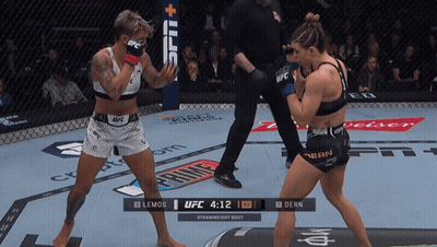 Two Women Fighting In UFC Ring Clock 4:12 GIF