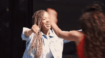 Two Women High Five One With Braids GIF