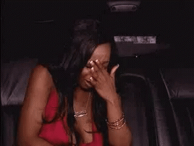 Two Women High-Fiving In Car GIF