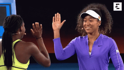 Two Women High-Fiving One With Purple Nike Jacket GIF
