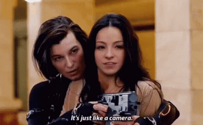 Two Women Holding Camera And Talking GIF
