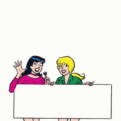 Two Women Holding Sign and Microphone