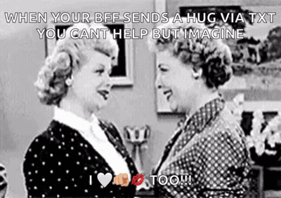 Two Women Hugging In Black And White GIF