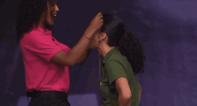 Two Women Hugging In Front Of Evidence Box GIF