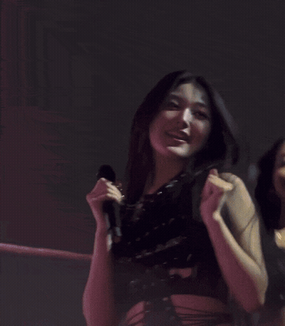 Two Women Hugging On Stage GIF